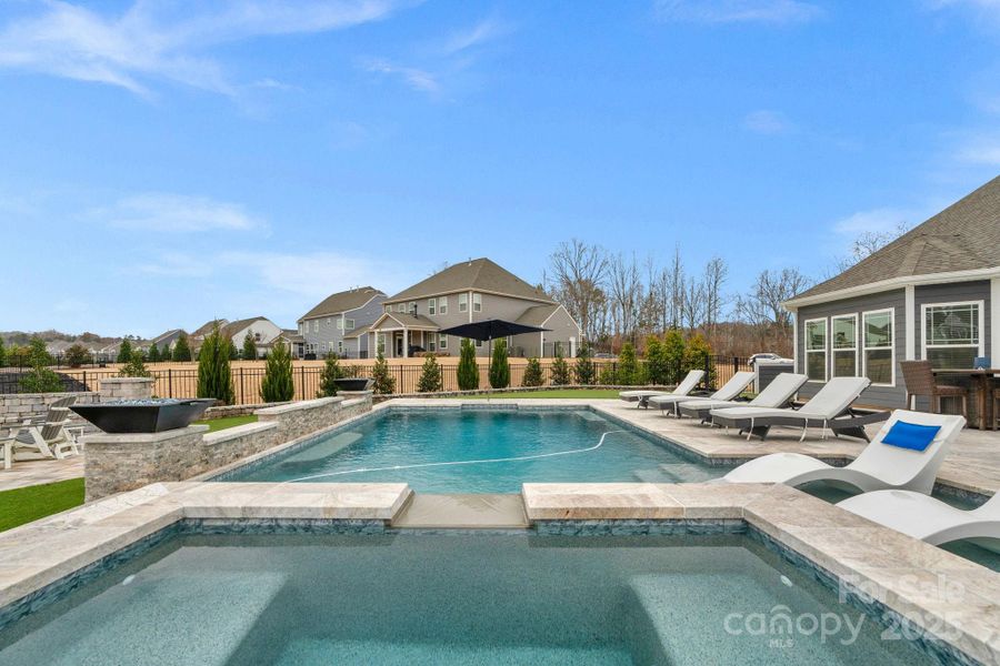 Spectacular in-ground pool & spa with Travertine decking