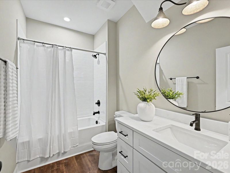 Stylish full bath features modern finishes, sleek fixtures, and a clean, contemporary design perfect for guests or everyday comfort.