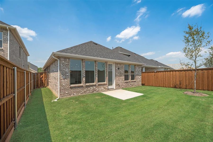 Front exterior of a new home in Spiritas Ranch, Little Elm, TX, highlighting curb appeal (Image 15). Front exterior of a new home in Spiritas Ranch, Little Elm, TX, highlighting curb appeal (Image 15).