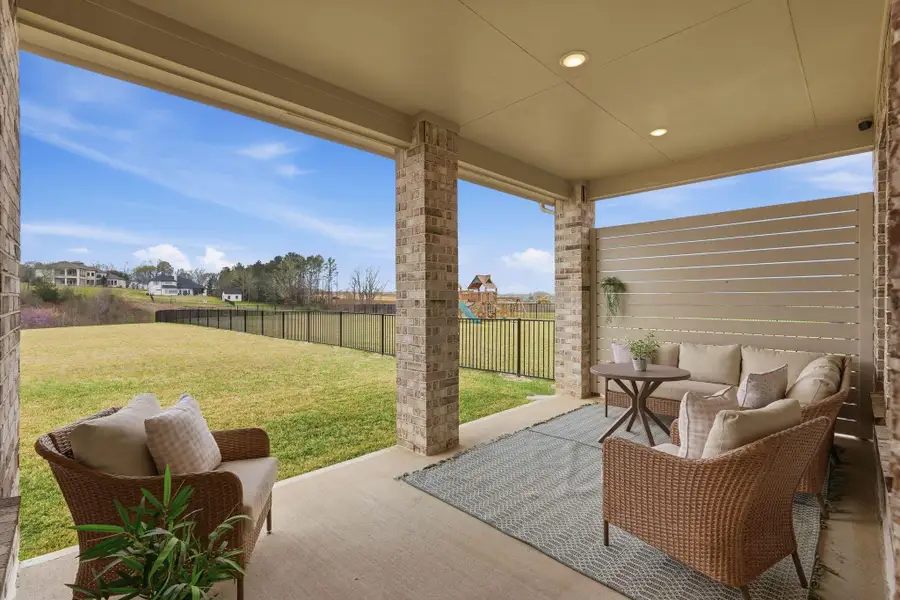 Exterior details and patio area of a home in Waterstone on Lake Conroe, Montgomery (Image 4).
