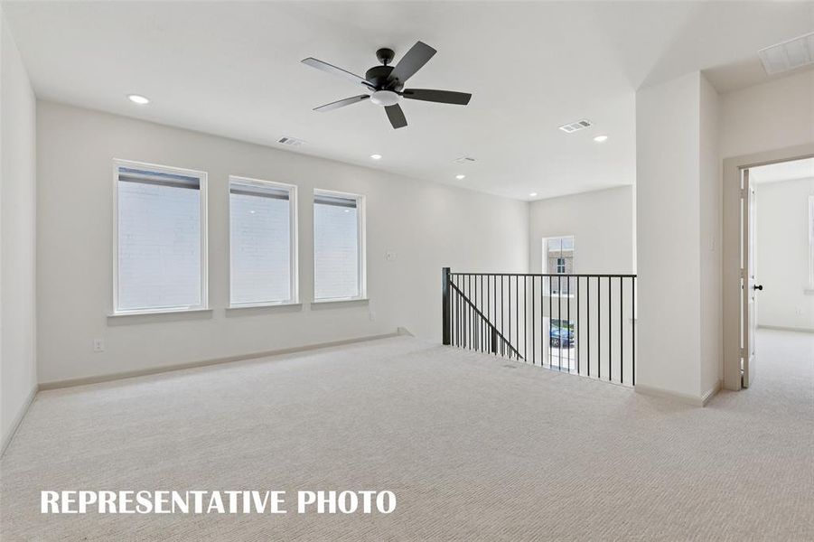 The spacious game room in our Bella plan provides the perfect place to host those big game day parties or family game night!  REPRESENTATIVE PHOTO