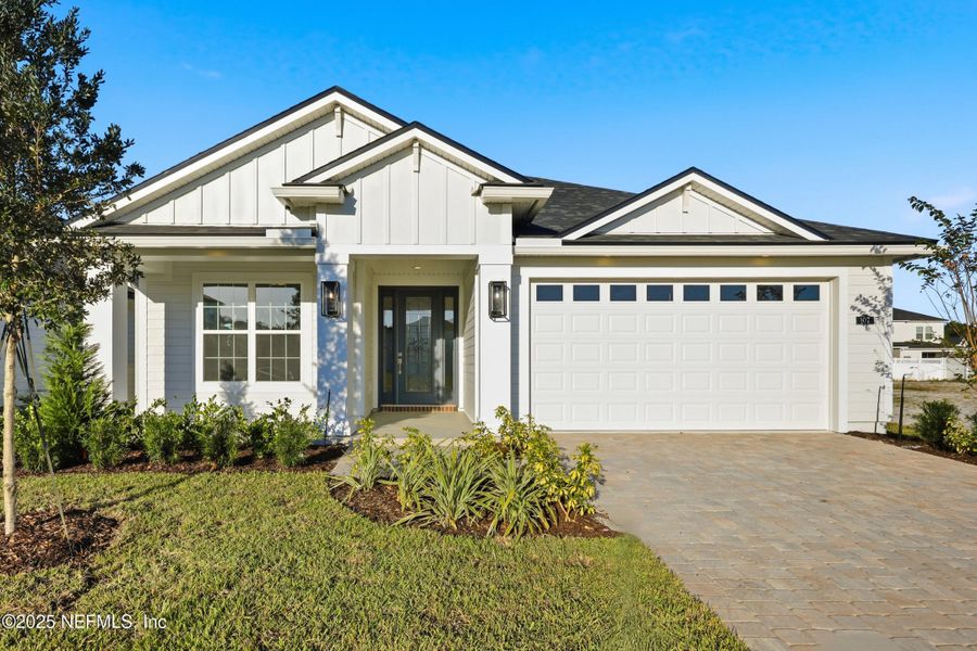 Front exterior of a new home in Silver Landing At Silverleaf, St. Augustine, FL, highlighting curb appeal (Image 1). Front exterior of a new home in Silver Landing At Silverleaf, St. Augustine, FL, highlighting curb appeal (Image 1).