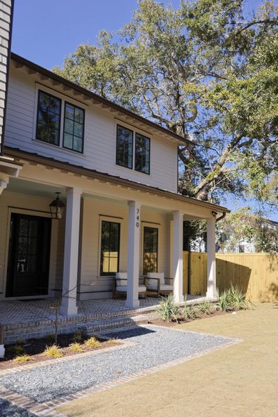 Front exterior of a new home in , Mount Pleasant, SC, highlighting curb appeal (Image 1). Front exterior of a new home in , Mount Pleasant, SC, highlighting curb appeal (Image 1).