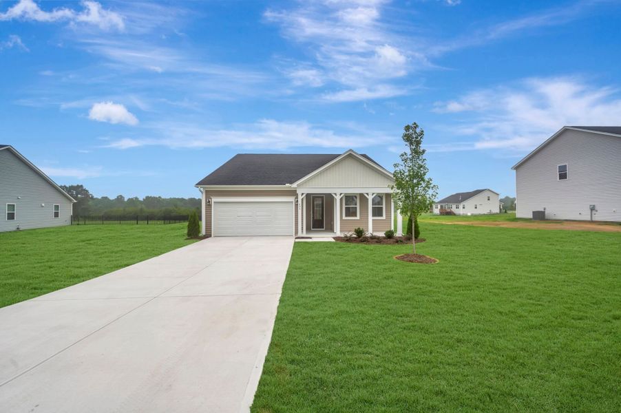 Front exterior of a new home in Fox Field Farms, Broadway, NC, highlighting curb appeal (Image 18).