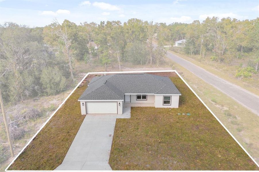 Front exterior of a new home in , Ocklawaha, FL, highlighting curb appeal (Image 2).
