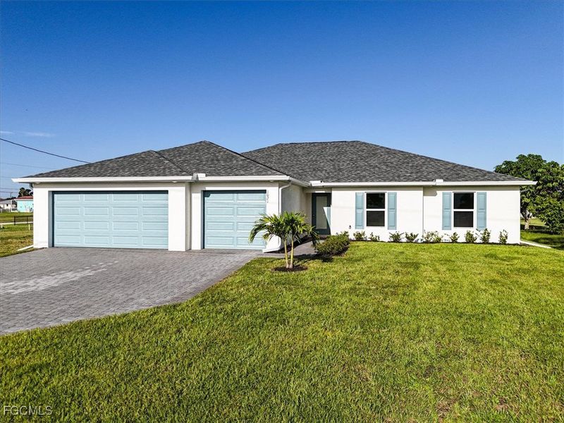Front exterior of a new home in Cape Coral, Cape Coral, FL, highlighting curb appeal (Image 1).