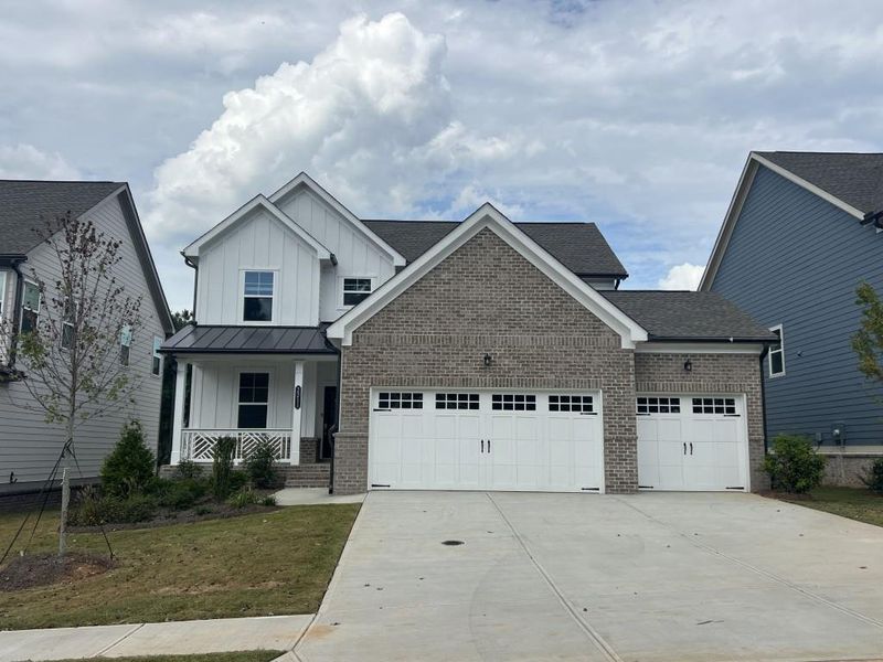 Front exterior of a new home in Willow Creek, Watkinsville, GA, highlighting curb appeal (Image 1).