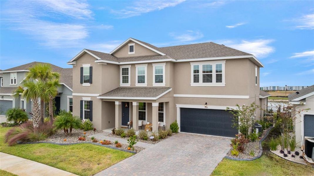 Front exterior of a new home in Seaire, Parrish, FL, highlighting curb appeal (Image 24).