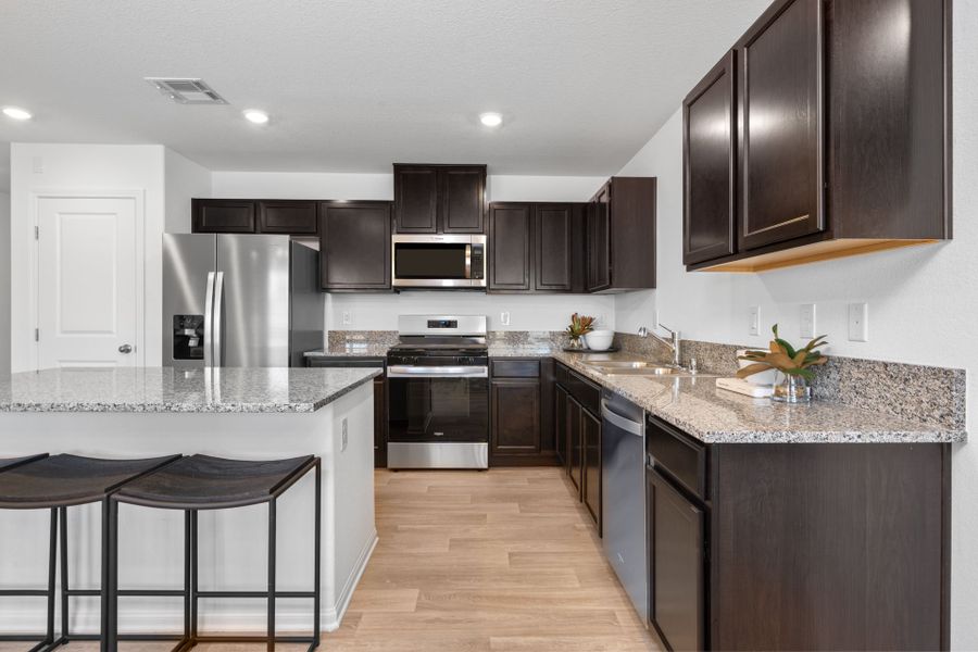 Representative furnished interior of a home built from the Kaufman by Pulte Homes in Strata, Dacono (Image 13).