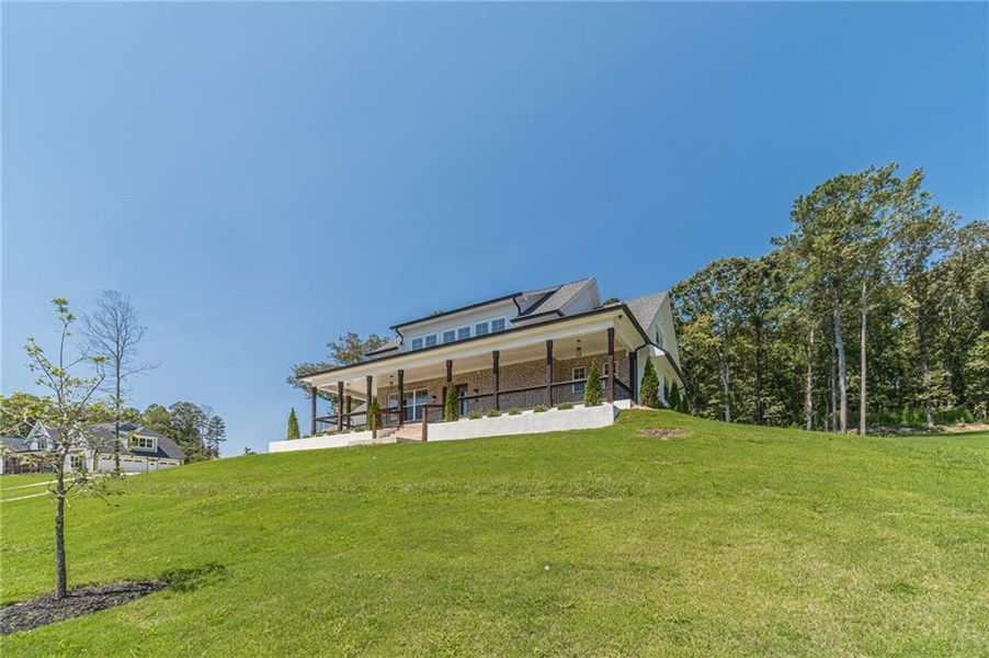 Front exterior of a new home in , Dacula, GA, highlighting curb appeal (Image 1).