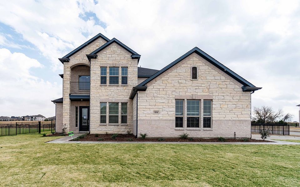Front exterior of a new home in Heath Golf & Yacht Club, Heath, TX, highlighting curb appeal (Image 1). Front exterior of a new home in Heath Golf & Yacht Club, Heath, TX, highlighting curb appeal (Image 1).