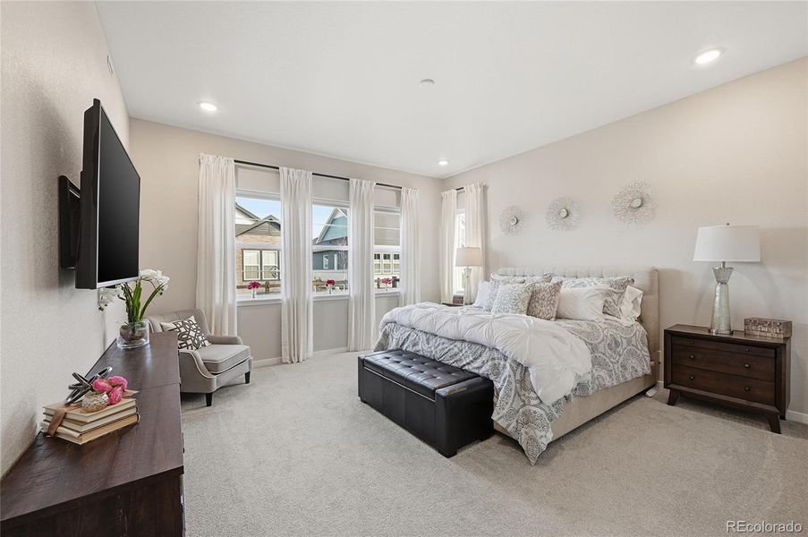 Lots of Windows Make the Primary Bedroom Light and Bright!