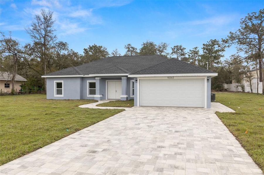 Front exterior of a new home in , Weeki Wachee, FL, highlighting curb appeal (Image 18).