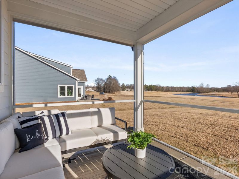 Exterior details and patio area of a home in Stonebridge Fairways, Monroe (Image 3).