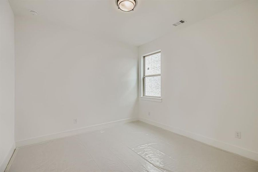 Spare room featuring baseboards Spare room featuring baseboards