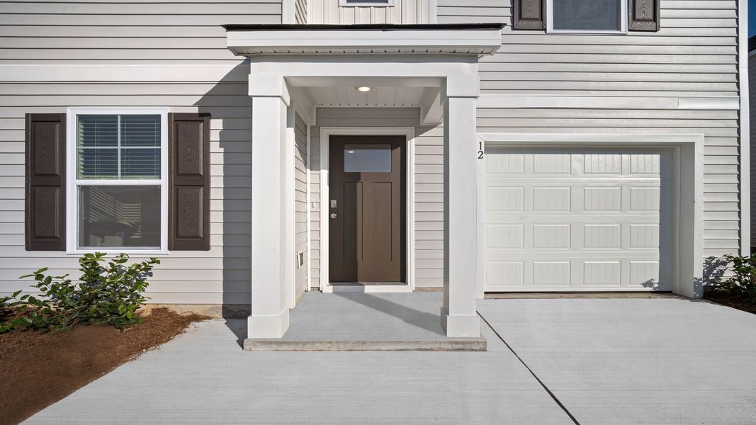 Front exterior of a new home in Rice Hope, Port Wentworth, GA, highlighting curb appeal (Image 2).