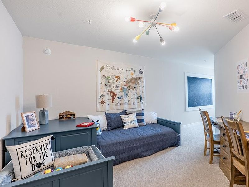 Large secondary bedrooms provide space for everyone in your household - Azalea townhome by Highland Homes
