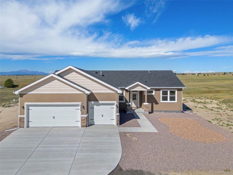 Front exterior of a new home in , Pueblo West, CO, highlighting curb appeal (Image 27).