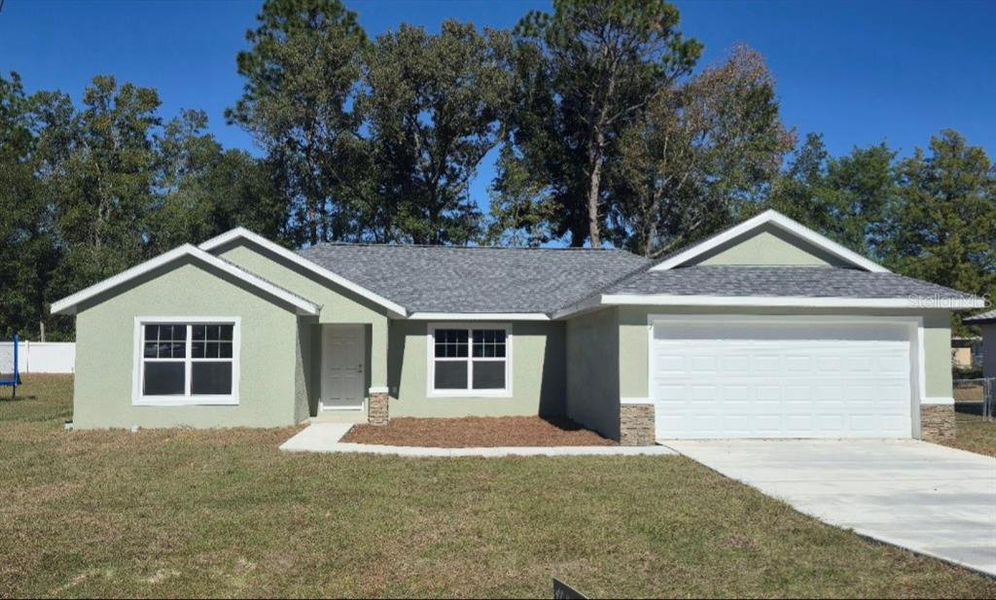 Front exterior of a new home in , Ocala, FL, highlighting curb appeal (Image 1).