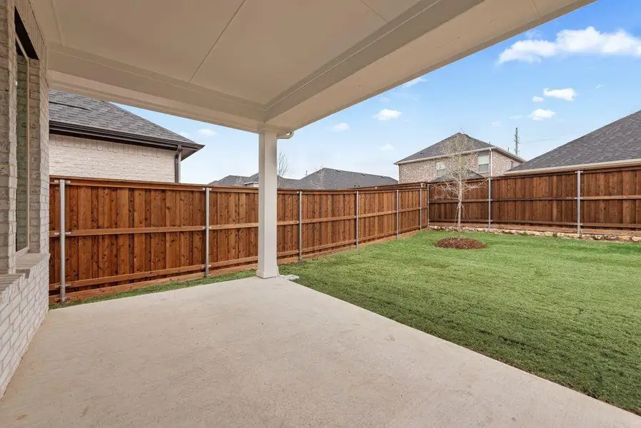 Exterior details and patio area of a home in Spiritas Ranch, Little Elm (Image 22).