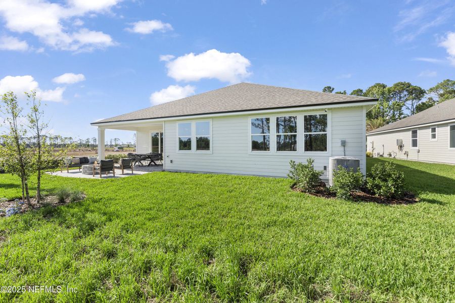 Exterior details and patio area of a home in The Cypress Series at Reserve East, Flagler Beach (Image 23).