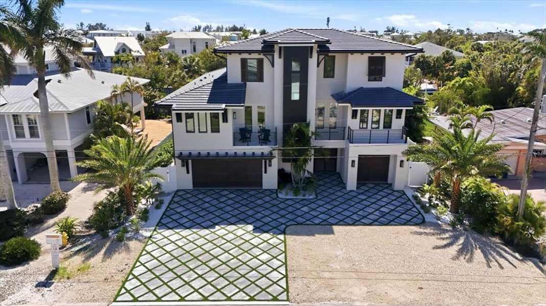 Front exterior of a new home in , Anna Maria, FL, highlighting curb appeal (Image 21).