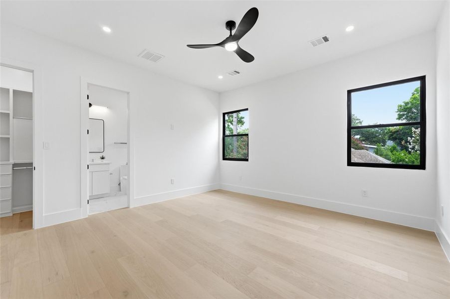 Upstairs bedroom three offers a spacious layout, abundant natural light, and a clean, modern design with room for a comfortable seating or study area