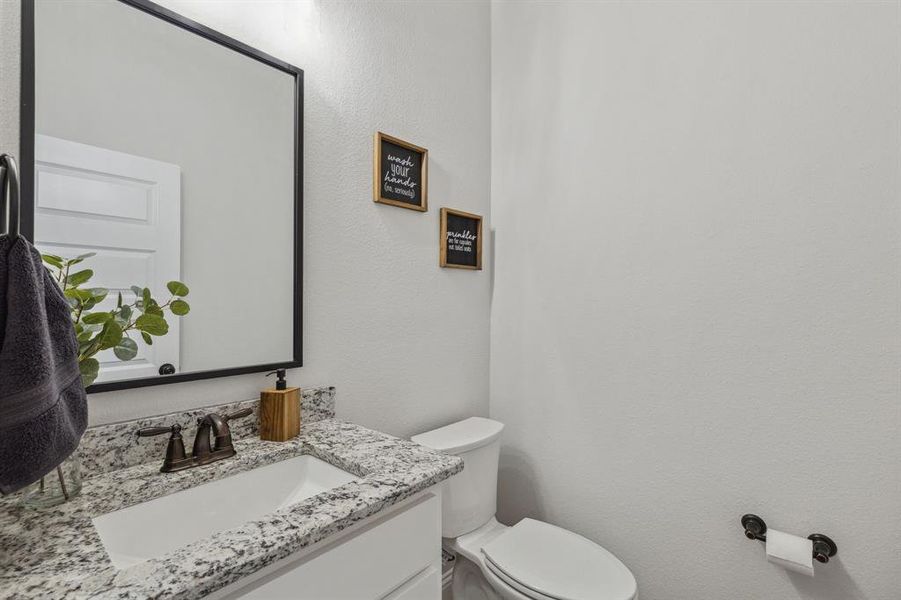 Bathroom with toilet and vanity