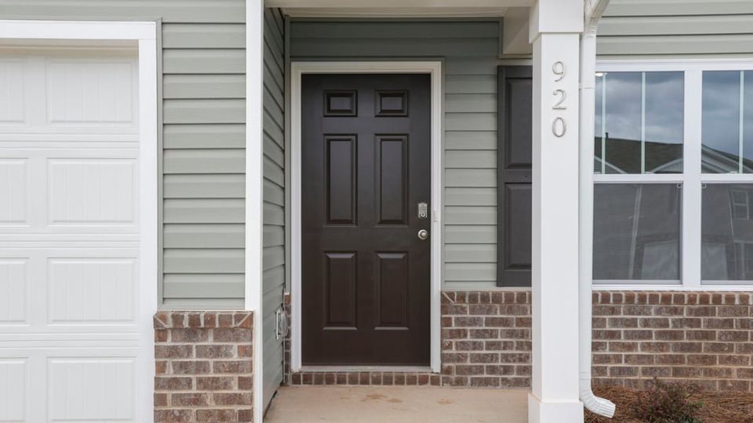 Exterior details and patio area of a home in Treemont Commons, Wellford (Image 4).