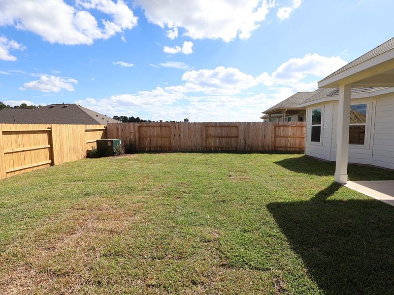 Exterior details and patio area of a home in Magnolia Ridge, Magnolia (Image 17).
