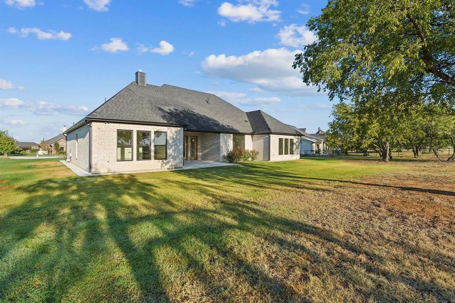 Quiet neighborhood with lovely custom homes; mature shade trees grace the backyard.