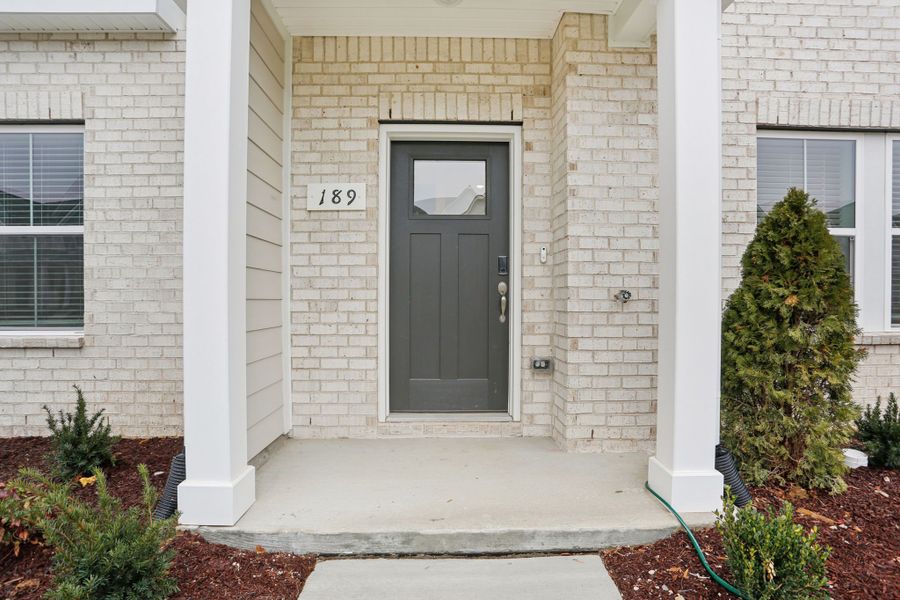 Exterior details and patio area of a home in Greystone - Highland Townhomes, Smyrna (Image 3).
