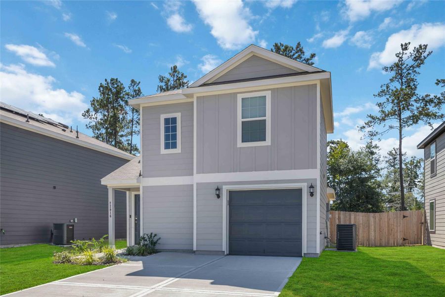 Front exterior of a new home in Townsend Reserve, Splendora, TX, highlighting curb appeal (Image 19). Front exterior of a new home in Townsend Reserve, Splendora, TX, highlighting curb appeal (Image 19).