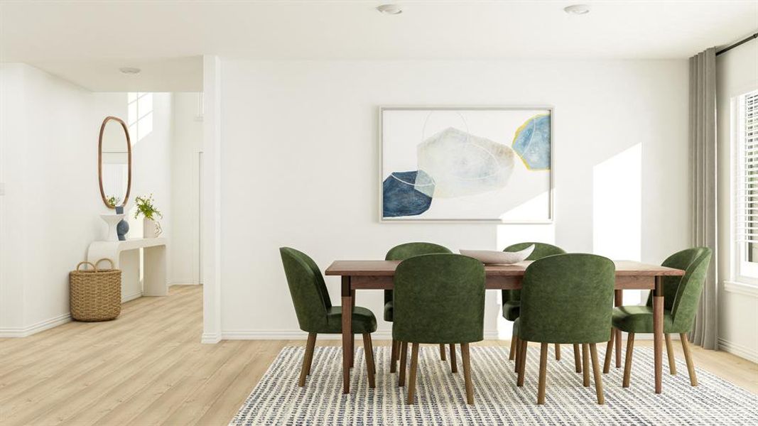 Dining area with light hardwood / wood-style flooring