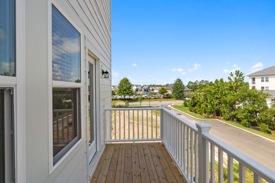 Exterior details and patio area of a home in Lakeside Townes at Riverlights, Wilmington (Image 4).