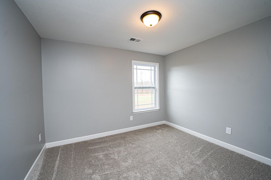 Representative unfurnished interior of a home built from the Saxon by Enchanted Homes in Guadalupe Heights, Seguin (Image 39).