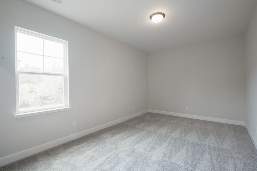 Representative unfurnished interior of a home built from the The McKee Manor by Cothran Homes in Holly Ridge, Greenville (Image 31). Representative unfurnished interior of a home built from the The McKee Manor by Cothran Homes in Holly Ridge, Greenville (Image 31).