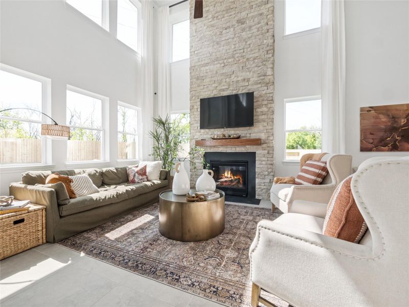 Bright and airy great room with cozy fireplace (*Photo not of actual home and used for illustration purposes only.) Bright and airy great room with cozy fireplace (*Photo not of actual home and used for illustration purposes only.)