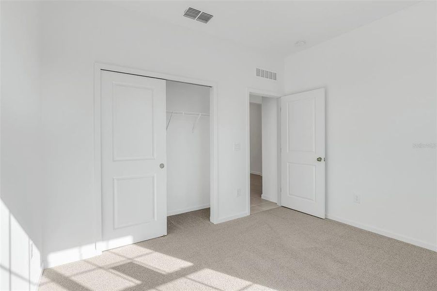 Bedroom 2 with closet view