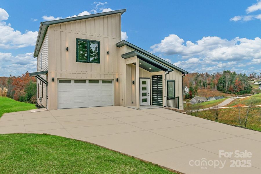 Front exterior of a new home in , Leicester, NC, highlighting curb appeal (Image 2). Front exterior of a new home in , Leicester, NC, highlighting curb appeal (Image 2).