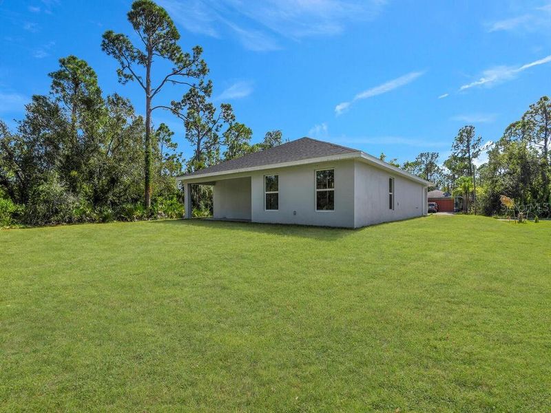 Front exterior of a new home in , Port Charlotte, FL, highlighting curb appeal (Image 11).