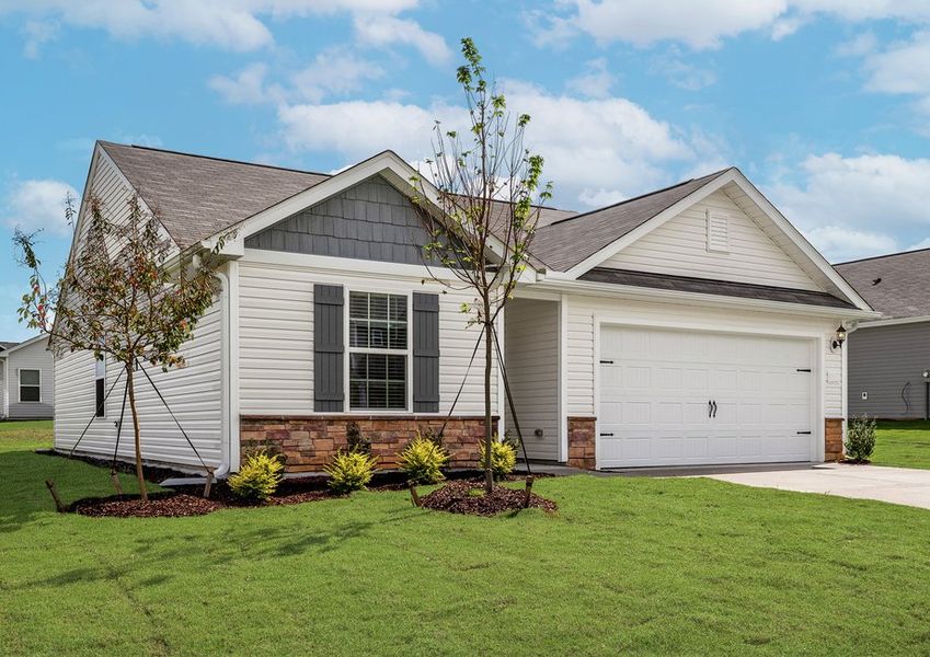 This home has a 2-car garage and stone detailing