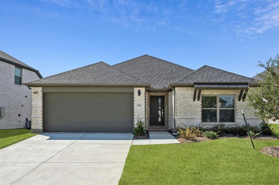 Front exterior of a new home in Devonshire, Forney, TX, highlighting curb appeal (Image 2). Front exterior of a new home in Devonshire, Forney, TX, highlighting curb appeal (Image 2).