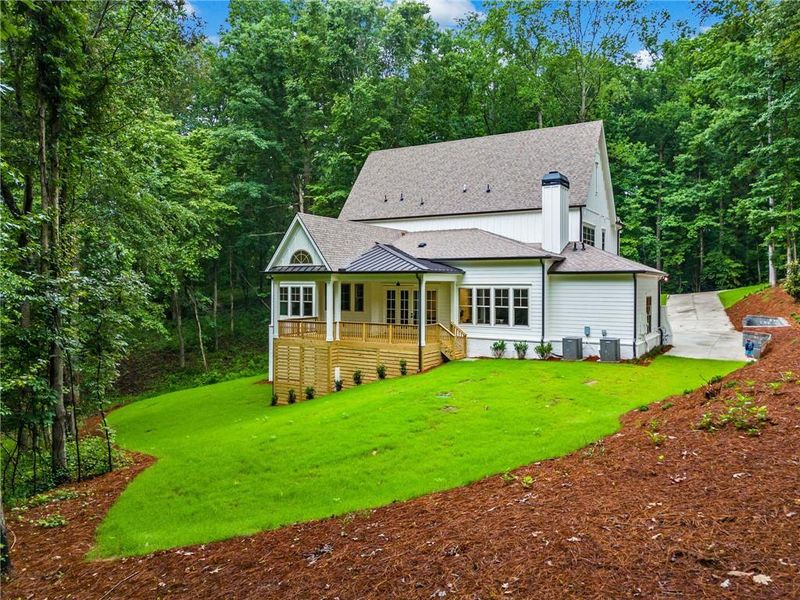 Front exterior of a new home in , Holly Springs, GA, highlighting curb appeal (Image 26). Front exterior of a new home in , Holly Springs, GA, highlighting curb appeal (Image 26).