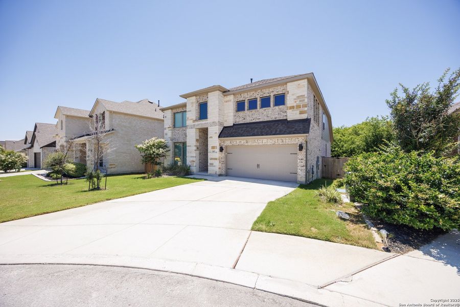 Front exterior of a new home in Weston Oaks 55', San Antonio, TX, highlighting curb appeal (Image 2). Front exterior of a new home in Weston Oaks 55', San Antonio, TX, highlighting curb appeal (Image 2).