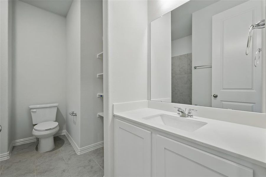 Bathroom featuring vanity and light tile patterned flooring