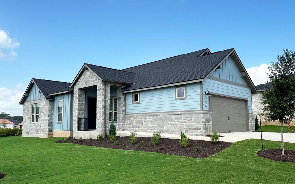 Front exterior of a new home in Cottage at Kissing Tree, San Marcos, TX, highlighting curb appeal (Image 1). Front exterior of a new home in Cottage at Kissing Tree, San Marcos, TX, highlighting curb appeal (Image 1).