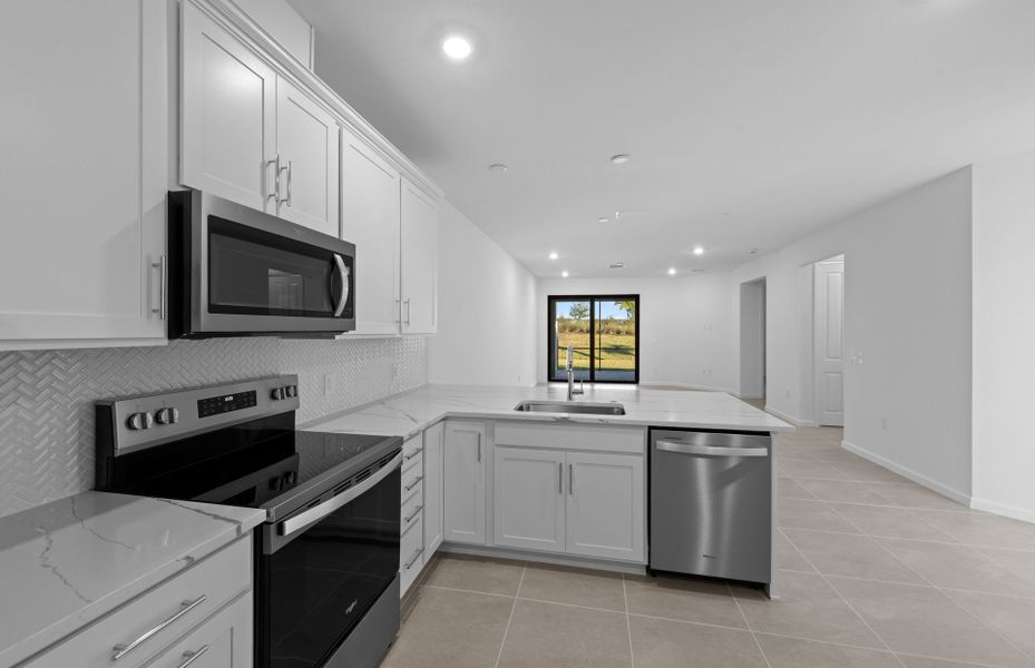 Furnished interior view inside a new home in Del Webb Naples, Ave Maria (Image 5).