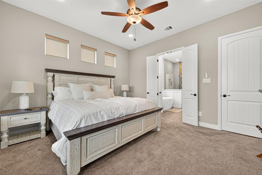 Spacious retreat with recessed lighting and direct access to the spa-inspired ensuite bath. Spacious retreat with recessed lighting and direct access to the spa-inspired ensuite bath.