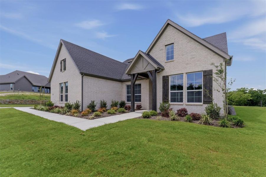 Front exterior of a new home in Eagle Ridge Estates, Weatherford, TX, highlighting curb appeal (Image 18).